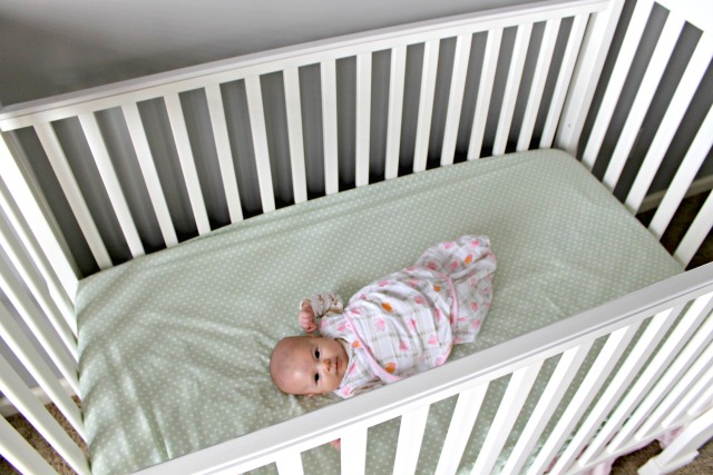 Baby in Crib Wrapped in Safe Sleep Sack