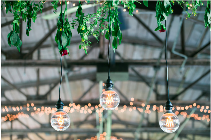 Floral details with hanging bulbs wedding reception