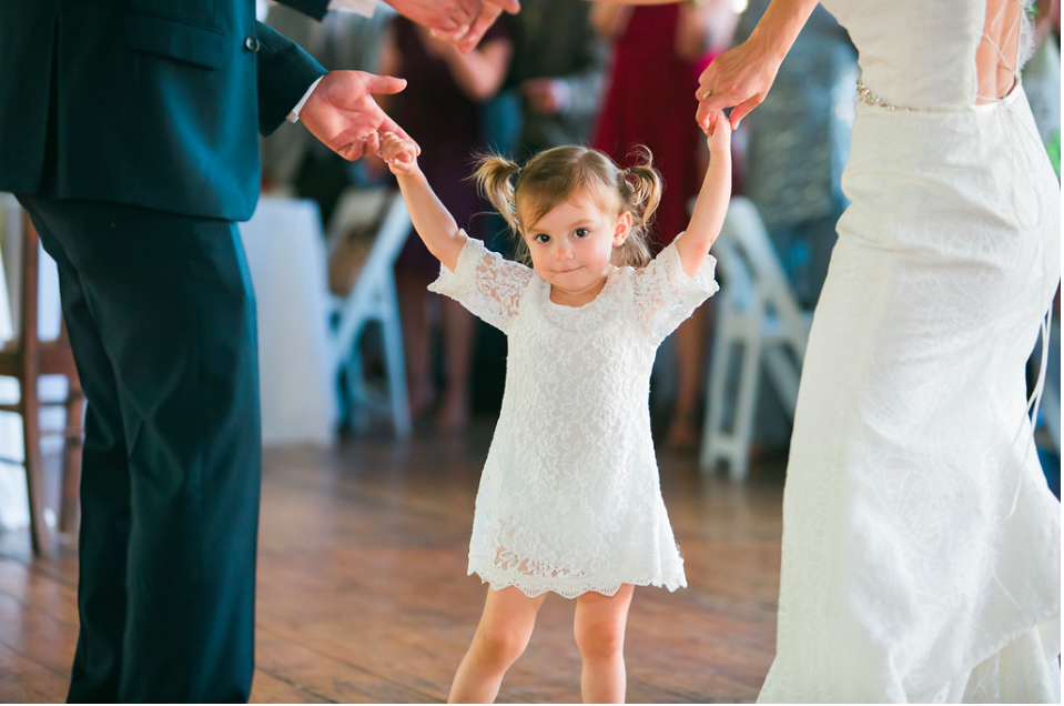 Bride and Groom dancing with flower girl at The Lace Factory