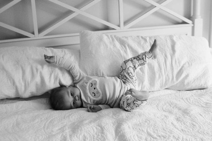 Baby flipping on bed