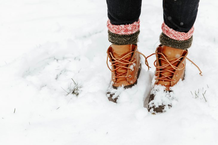 LL Bean Boots with Red and Gray Camp Socks Standing in the Snow