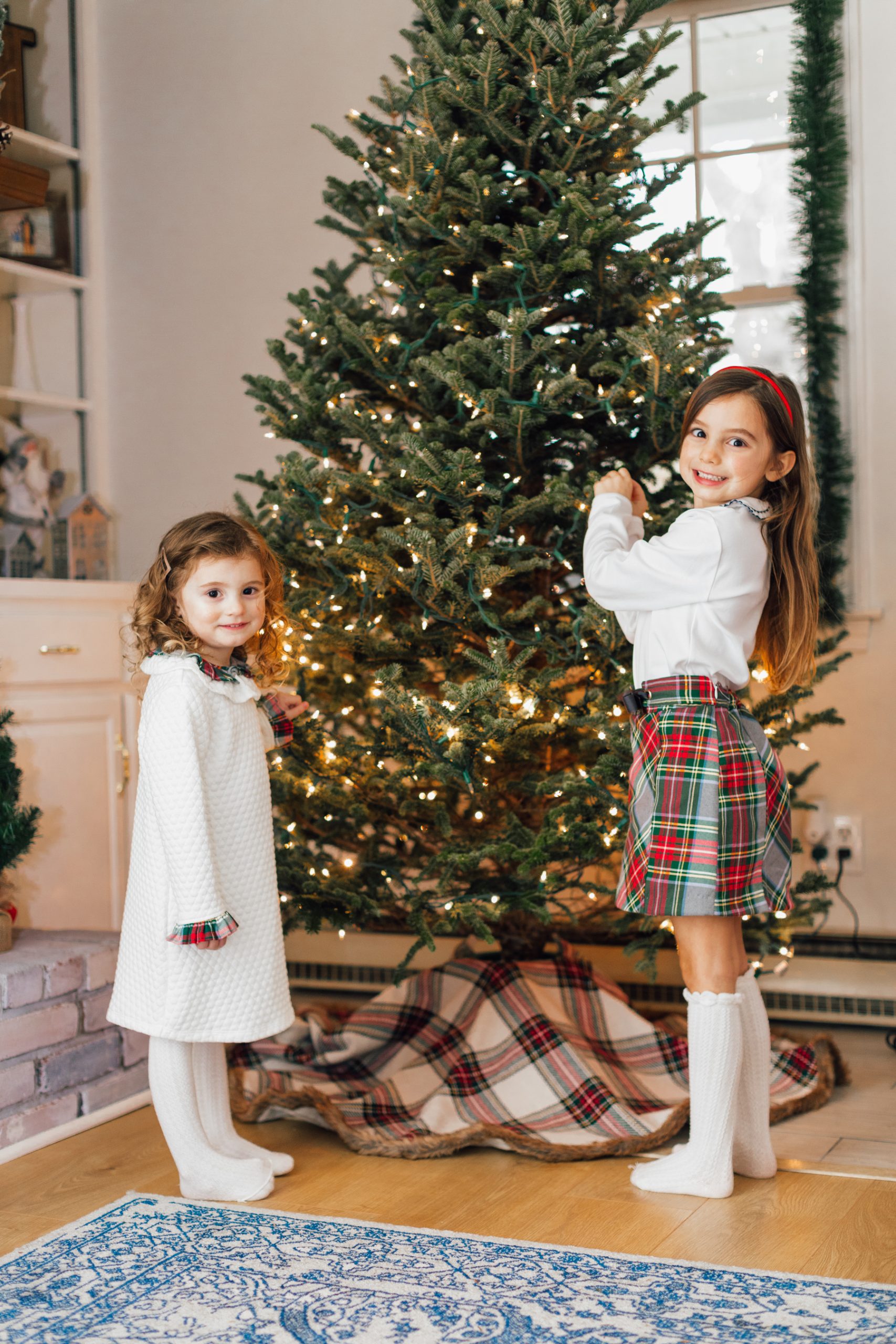 Girls decorating Christmas Tree