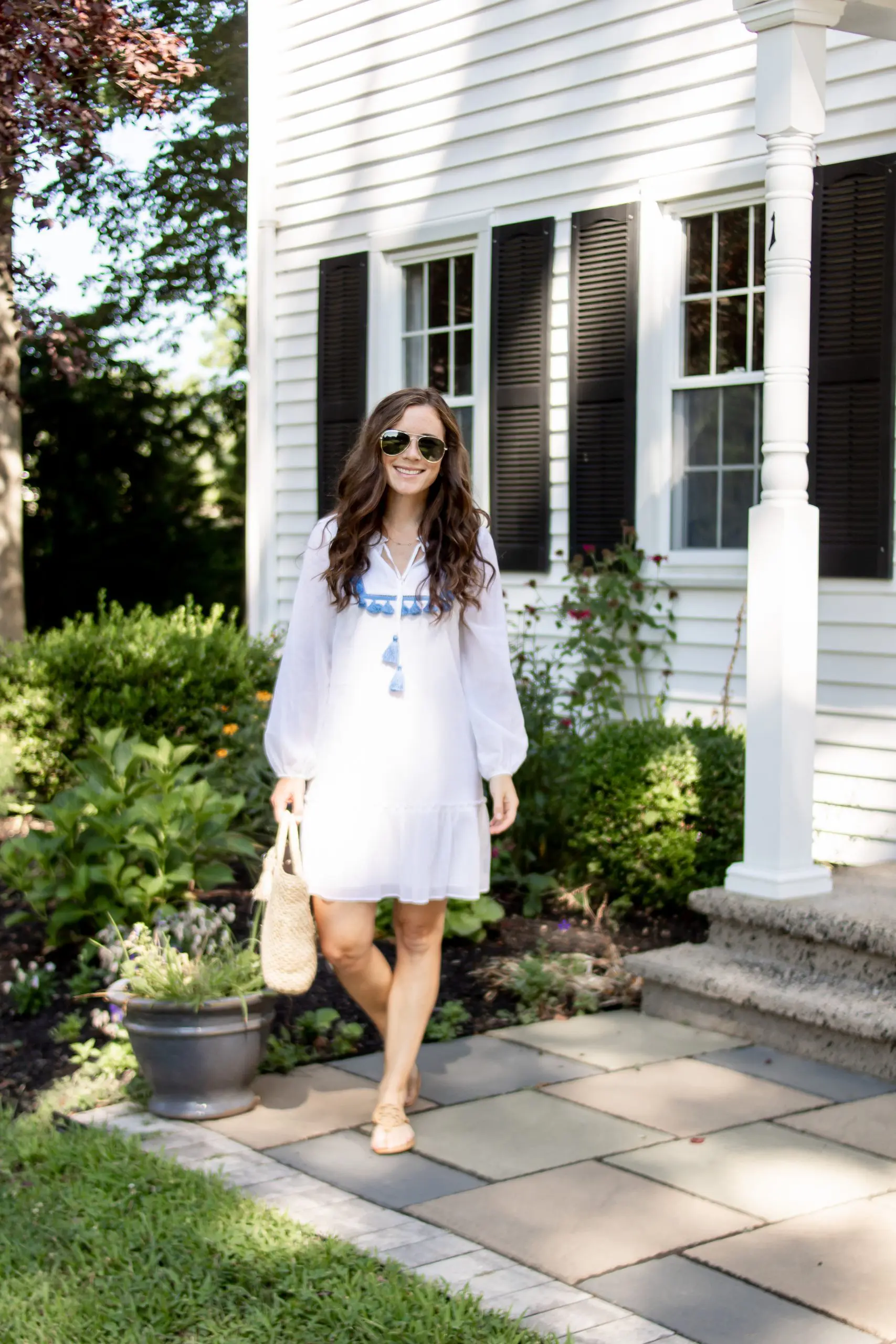 woman in white sail to sable dress for summer from monelle vermont