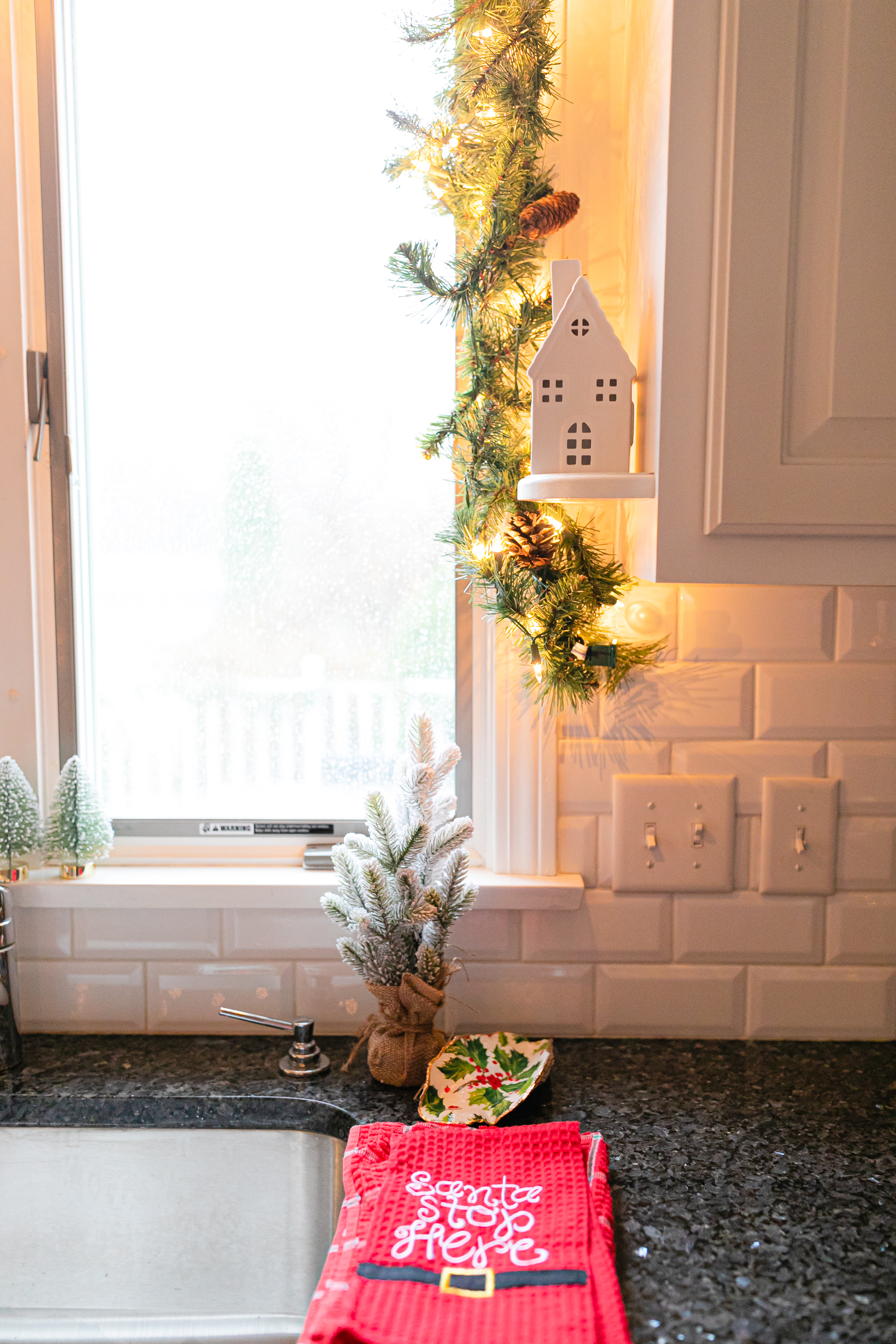 real garland above kitchen sink with lights