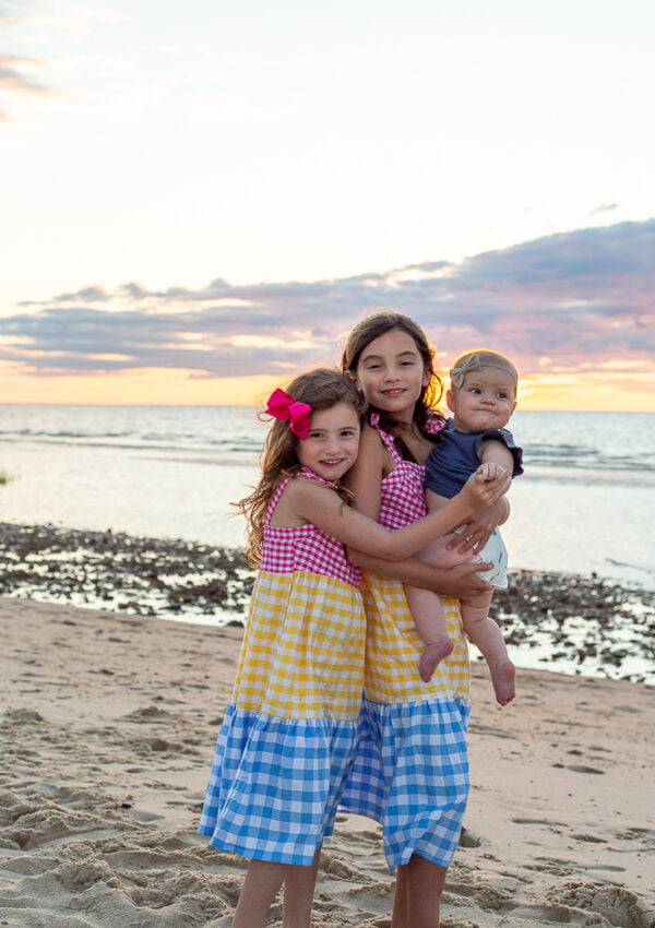sisters on beach during sunset