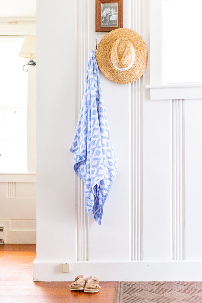 towel and hat hanging in basin harbor cottage