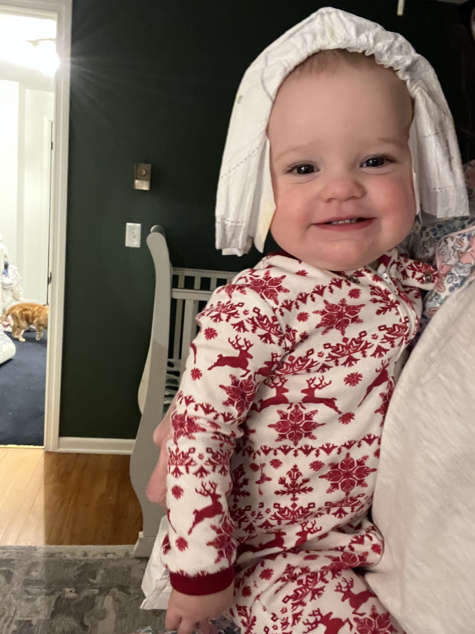 baby with diaper on her head