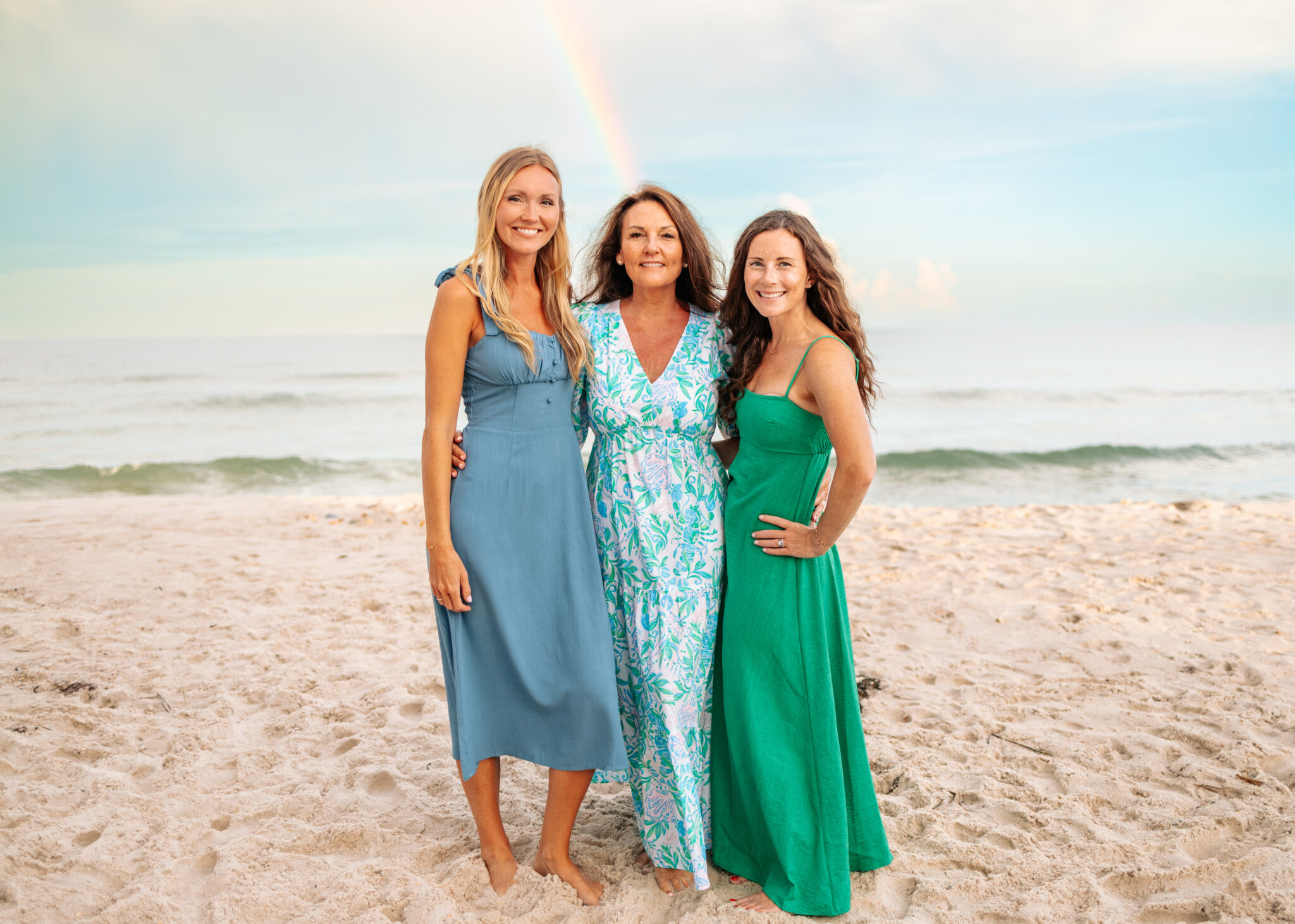 Mom and Adult Daughters in blue and green dresses beach family photos